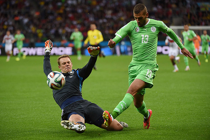 Germany's goalkeeper Manuel Neuer (L) ta