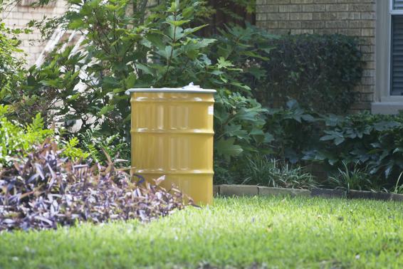 A metal barrel containing contaminated belongings of a health worker at the Texas Health Presbyterian Hospital who has contracted Ebola is in front of the health worker's residence in Dallas
