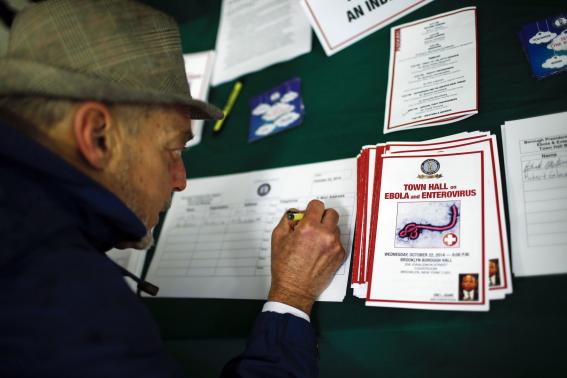 A man attends a town hall meeting on Ebola and Enterovirus D68 in the courtroom of Brooklyn Borough Hall in New York