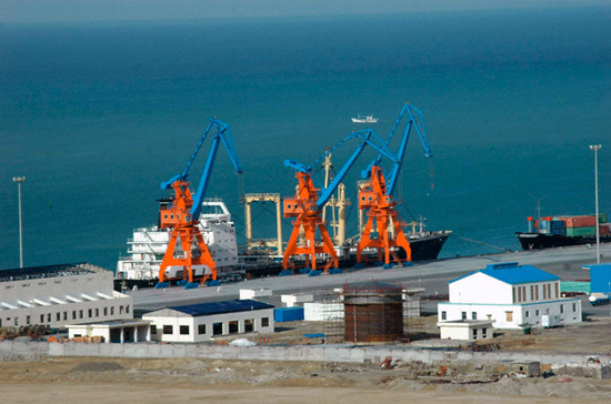 19 Mar 2007, Gwadar, Pakistan --- A ship is seen anchored at Pakistan's Gwadar deep-sea port on the Arabian Sea. Pakistan tightened security around a coastal town in Baluchistan province before the opening of a port authorities hope will bring prosperity to the remote and troubled region. --- Image by ?Reuters/Corbis