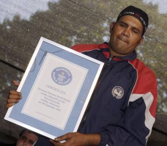Pakistani having Guinness world record certificate for lifting 65 kg from his ear 