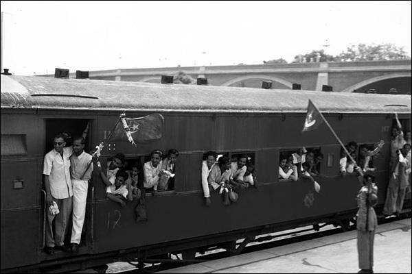 Muslim refugees travelling towards their newly-created homeland of Pakistan; note the new flag of the fledgling country