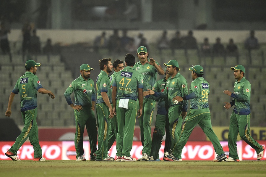 Pakistan cricketers celebrate after the dismissal of the Sri Lanka cricketer Dinesh Chandimal during the Asia Cup T20 cricket tournament match between Pakistan and Sri Lanka at the Sher-e-Bangla National Cricket Stadium in Dhaka on March 4 , 2016. / AFP / MUNIR UZ ZAMAN (Photo credit should read MUNIR UZ ZAMAN/AFP/Getty Images)
