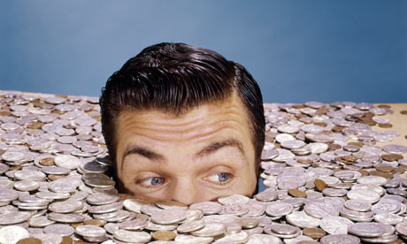 mans-head-in-pile-of-mone-007