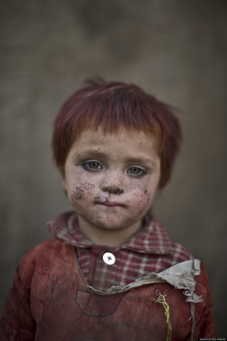In this Friday, Jan. 24, 2014 photo, Afghan refugee girl, Gul Bibi Shamra, 3, poses for a picture, while playing with other children in a slum on the outskirts of Islamabad, Pakistan. For more than three decades, Pakistan has been home to one of the worlds largest refugee communities: hundreds of thousands of Afghans who have fled the repeated wars and fighting their country has undergone. Since the 2002 U.S.-led invasion of Afghanistan, some 3.8 million Afghans have returned to their home country, according to the U.N.s refugee agency. (AP Photo/Muhammed Muheisen)
