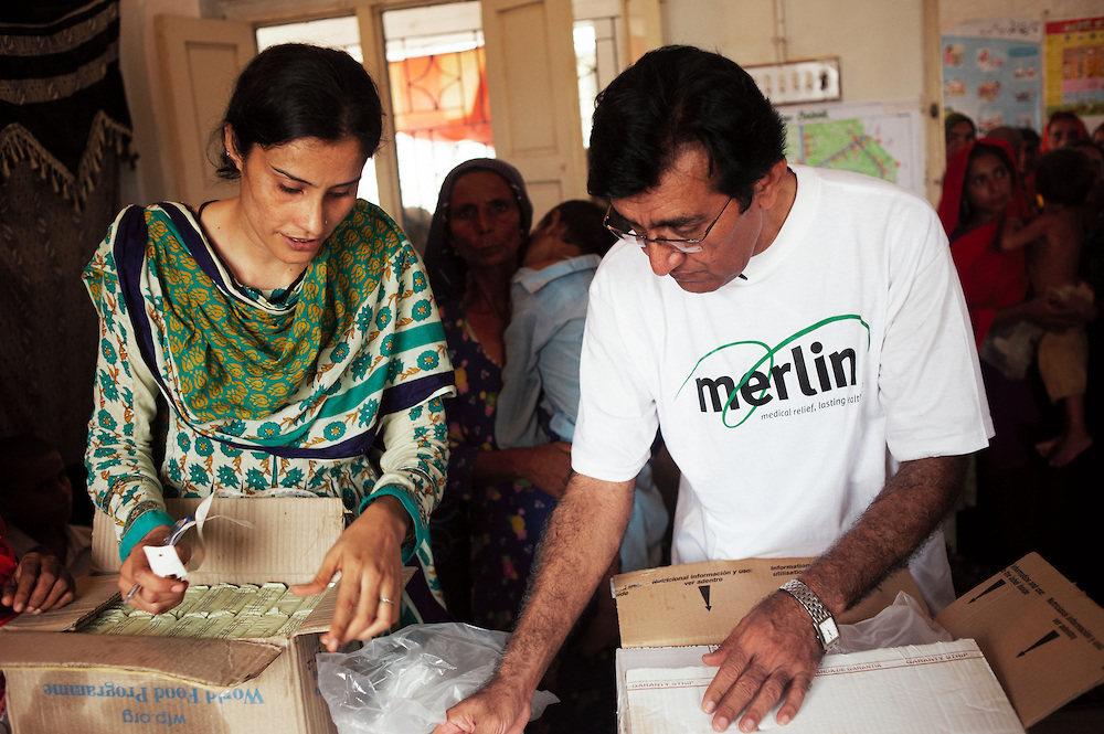 Shameem Akhtar, a Merlin lady health visitor with Doctor Muhammad Afzal, Project Medical Coordinator working at the government health centre in Mitho Barbar, Dadu, Thatta, Sindh, Pakistan on July 4, 2011.