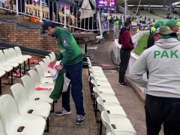 Pakistani Fans cleaning the stands
