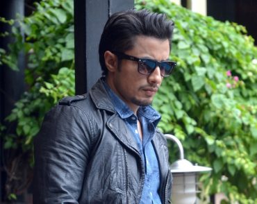 Ali Zafar walking during a press conference
