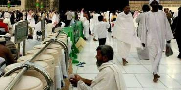 A muslim drinking ZAM ZAM water in the Holy Mosque