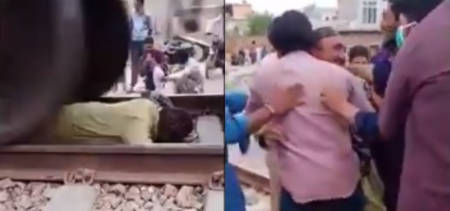 man lying railway track