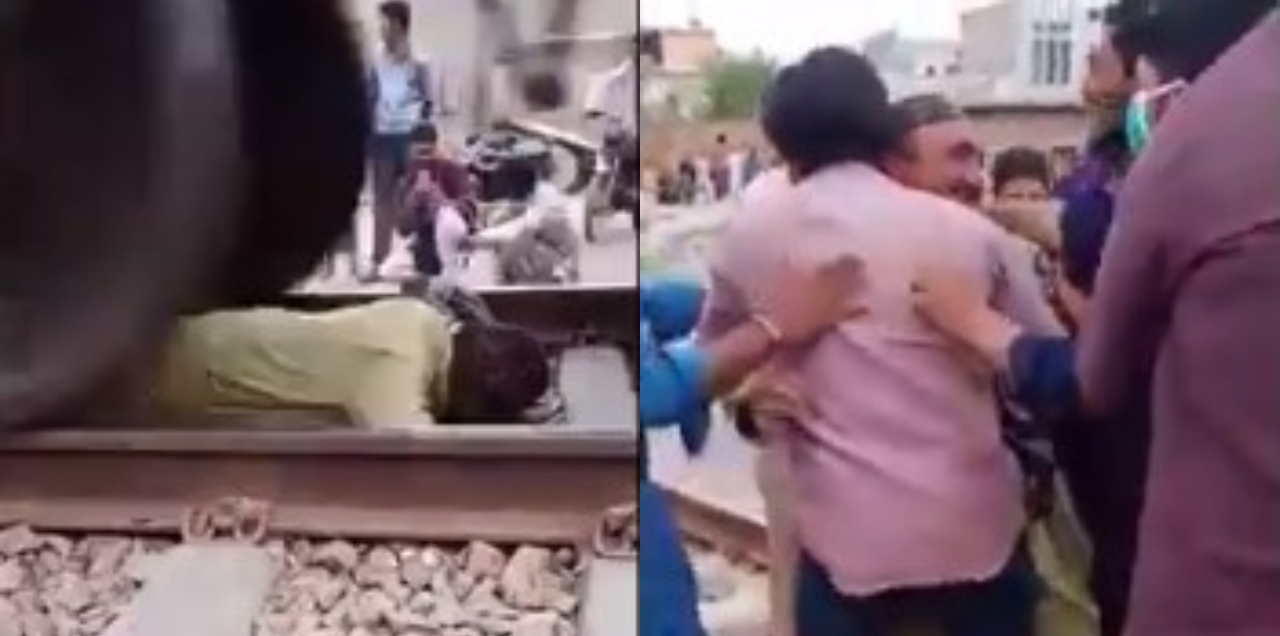 man lying railway track