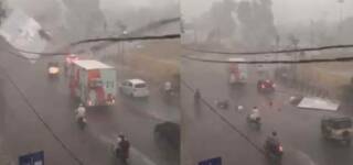 billboard falls rains karachi