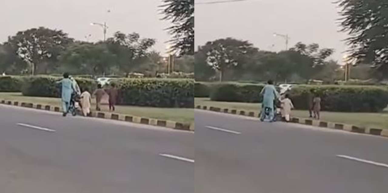 man teaches wife motorbike