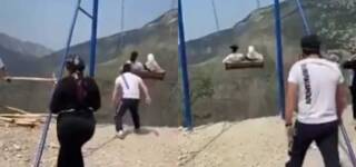 women fall off swing russia