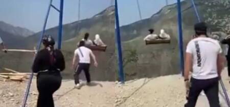 women fall off swing russia
